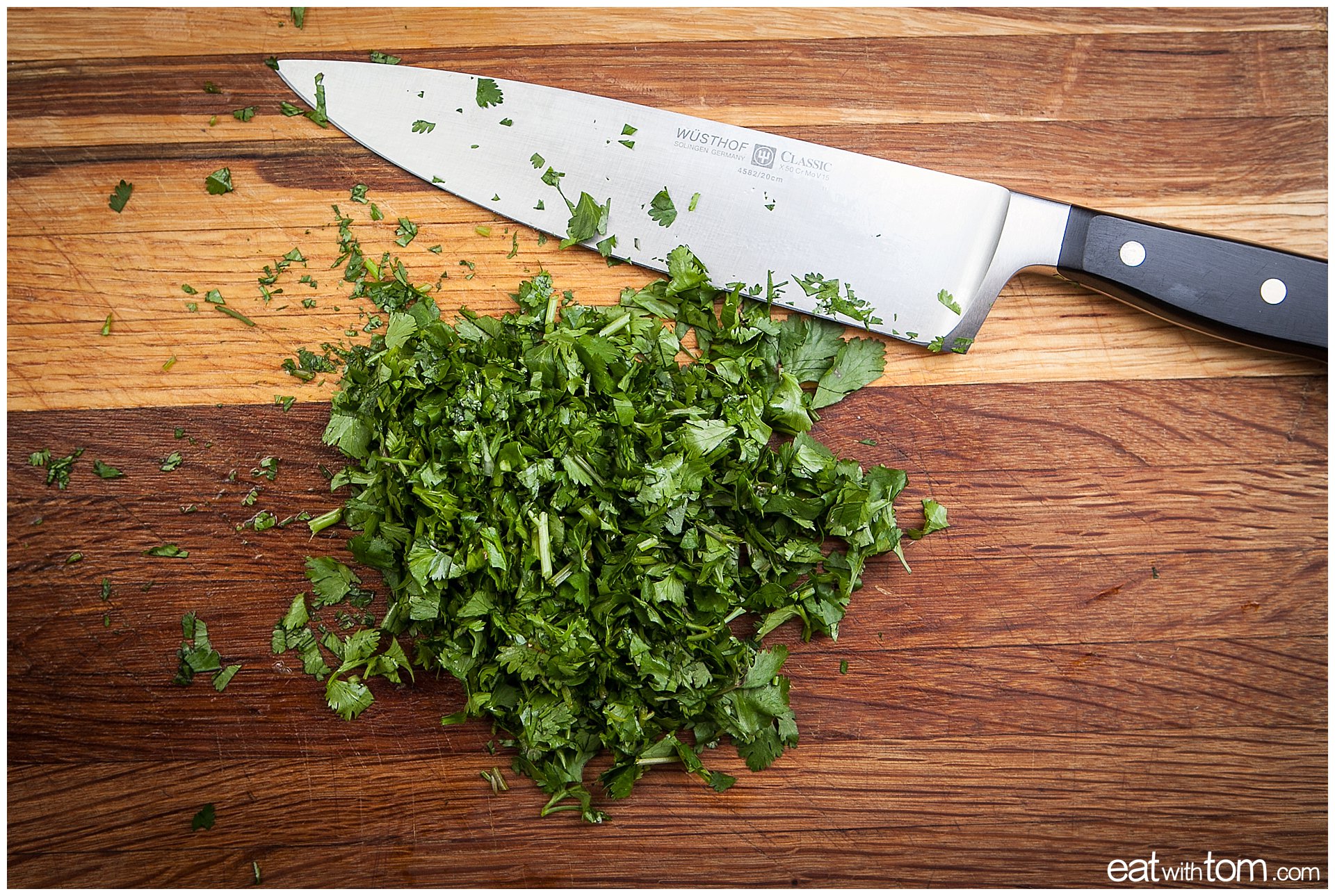 Wustof Knives - Chef knife techniques to cut cilantro on wooden cutting board